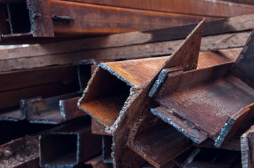 Pipes at the construction site. Square metal blanks.