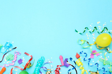 Colorful ribbons with yellow balloon and confetti on blue background - obrazy, fototapety, plakaty