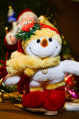  Soft toy snowman skiing on a blurred background