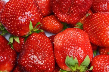 juicy ripe red strawberries on a white background