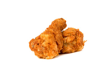 Fried legs on a white background. Chicken legs deep fried close-up.
