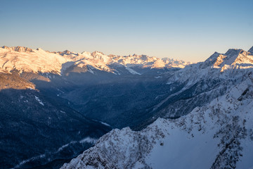 Fototapeta premium Evening in the mountains. Winter sunset in the Caucasus mountains.