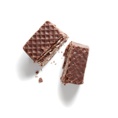 Wafer cube with chocolate and milk broken into two halves