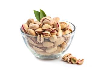 Pistachios in Glass Bowl on white background