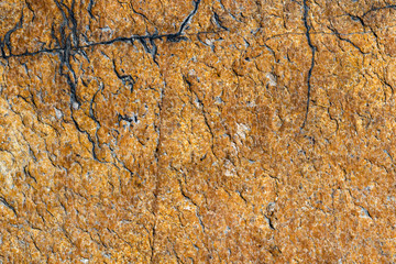 texture of brown stone or marble with vertical and horizontal cracks