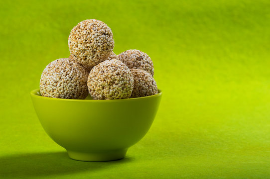 Amaranth or Rajgira laddu, Cholai ke laddo in green Bowl on green background