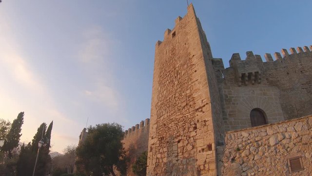 Capdepera Castle, Mallorca, Balearic islands, Spain. Old medieval fortification built in the XIV century. Ancient fortress. Outside view of walls. 4K footage during sunset, evening time