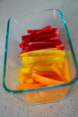 an array of peppers prepped in a glass dish