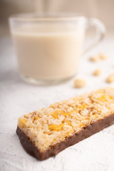 Healthy breakfast. Organic milk. Cereal granola bar. Glass cup with organic milk. Nut milk without lactose, gmo, antibiotics and casein. Diet food.  ..