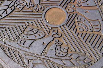 Close-up of Beautiful Decorative Manhole Cover / Sewer Cap.