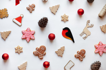 Christmas and New Year's eco decorations and homemade gingerbreads on a white background. Perfect festive backdrop for your Christmas Card. Flatlay style.