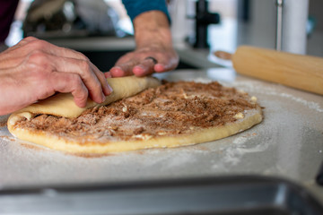 rolling cinnamon roll dough 
