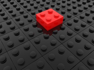 Black toy brick background with red bricks in the center