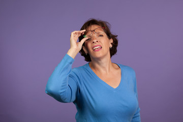 Woman adjusting her glasses