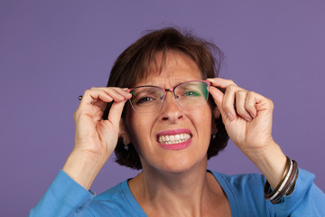 Woman adjusting her glasses