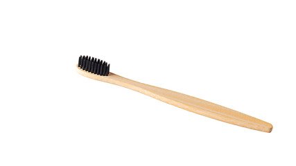 Wooden bamboo toothbrush on white background isolated. The concept of zero waste, recycling, environmental consciousness, social environmental responsibility. Change lifestyle
