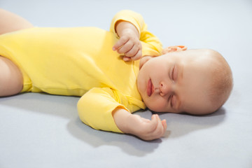 Newborn sleeping on the bed, New family and baby protection concept