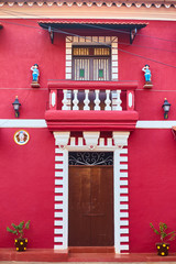 Panaji, India - December 15, 2019: A narrow lane surrounded by colorful portuguese houses in Panjim, Goa - obrazy, fototapety, plakaty