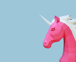 Paper unicorn head on a blue trend background. Geometry, bright and pastel colors. © liubovyashkir