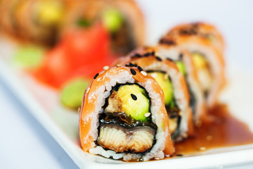 Close up of sushi roll with fish and avocado