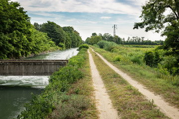 a dirt road along the Quintino Sella Irrigation Canal next to Garlasco, province of Pavia, Lombardy region, Italy