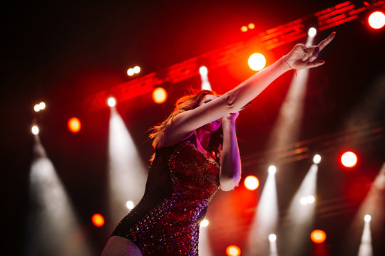 Singer On The Stage Of A Night Club In The Rays Of Lights