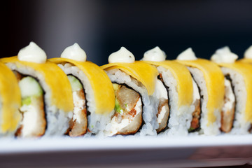 Sushi roll wrapped with egg and mayonnaise 