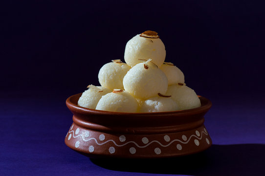 ndian Sweet or Dessert - Rasgulla in clay pot