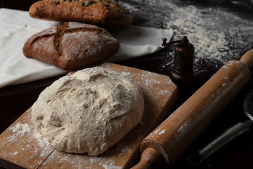 Making dough by female hands at bakery