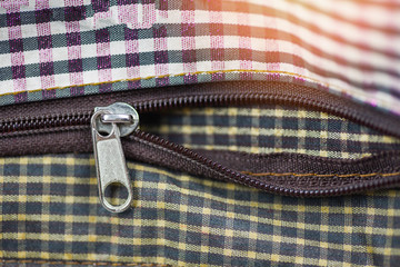 Metallic zipper for clothes / Close up open zip on handbag /