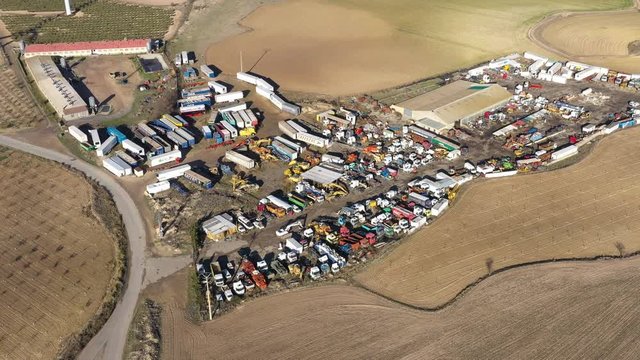 junkyard aerial shot lots of old trucks Spain abandoned wrecked cars