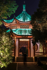 Fototapeta premium Night view of Chinese Pavillion with light decoration at East Lake, Wuhan Hubei / China.