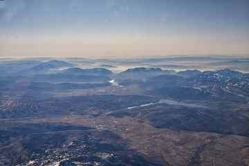 Wasatch Front Rocky Mountain Range Aerial view from airplane in fall including urban cities and the Great Salt Lake around Salt Lake City, Utah, United States of America. USA.