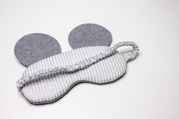 DIY gift for the new year, mask for sleeping. Gray mouse. Sleeping eyes. The symbol of the new year.