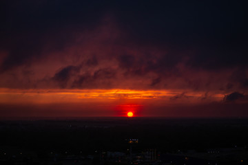 Epic Sunset. Sky. Foggy Clouds. Apocalypse. The sky before a thunderstorm. horizon. Gloomy clouds. End of the world. threat. Epic dramatic sunset