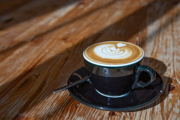 Cappuccino on wooden table-2
