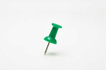Close up of Green pin  on white background