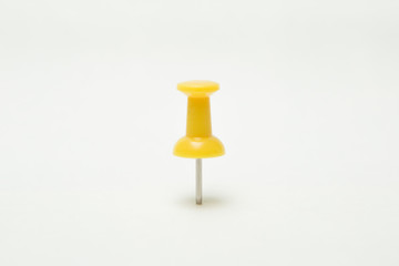 Close up of Yellow pin  on white background