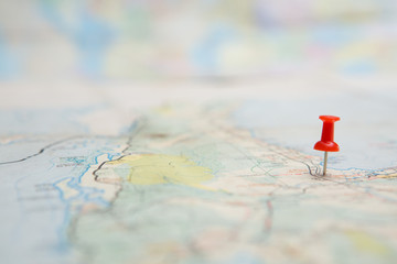 Selective focus of  Red pin on map background