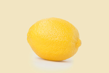 A golden lemon  Isolated on solid background.