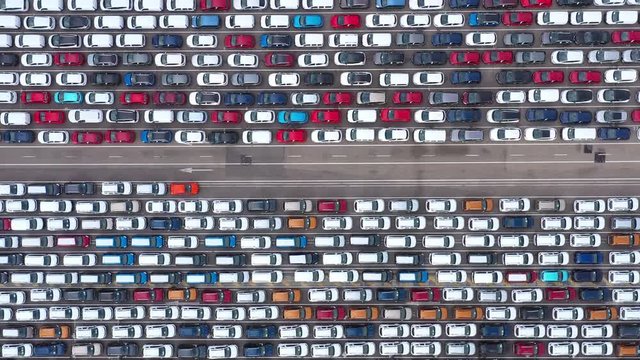 cars parked by hundreds aerial top view Malaga harbour Spain