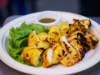 Street foods - Grilled squid. Squid eggs. Grilled squid is food in Thailand