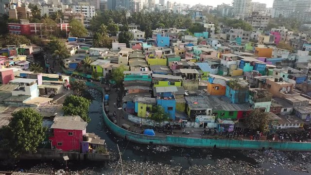 Houses and Garbage in River Canal in Dharavi Slum, Mumbai India. Poor Hygiene Without Sewage System, Aerial