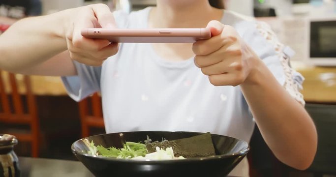 woman take picture for food