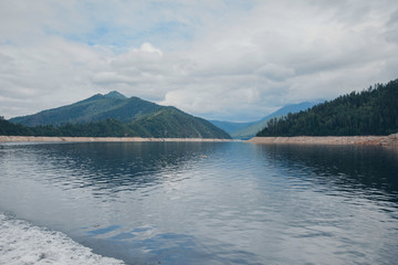 the concept of boating, relaxing at sea - splashes of blue water in the sea close-up