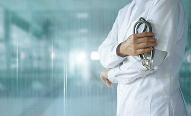 Medicine doctor with stethoscope in hand on hospital background,  Medical technology, Healthcare...