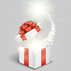 Open gift box and magical light