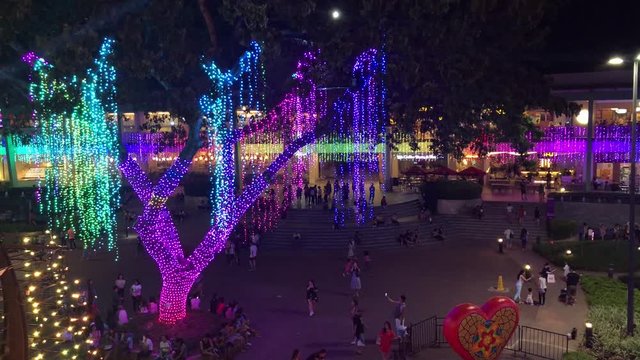 Cebu City/Philippines - 12/22/2019: People playing under Christmas and New Year Lights in a big asian mall