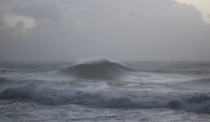 Waves in Nazare with a cloudy sky