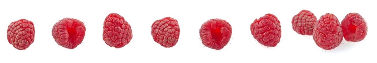 Panoramic shot of ripe red raspberries on white background.